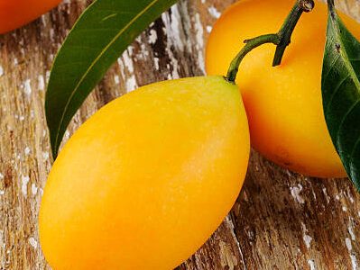 sweet maprang on wood background